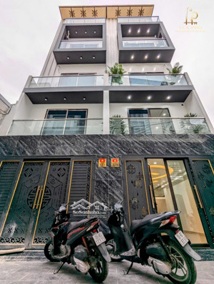 nhà đẹp xây mới có thang máy ô tô vào nhà tại miếu hai xã. ngay chợ hàng aeon