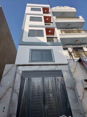 bán nhà siêu đẹp , có thang máy 5 tầng , đường xe hơi tránh nhau . ngay lê văn quới