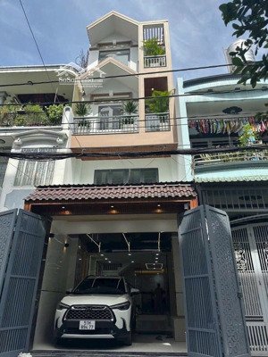 nhà đẹp xinh 4 tầng ở ngay, xe hơi ngủ trong nhà, hẻm ô tô 6m thông , ngay sát công viên làng hoa,