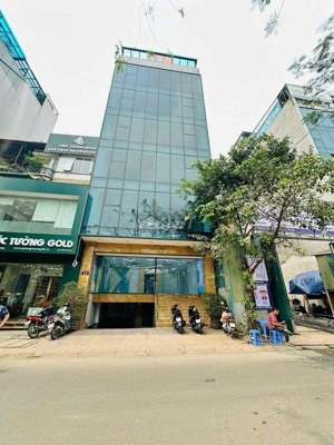 cho thuê toà nhà vp mới tinh nguyễn khang, 130m x 8t, hầm, mt 12m, thông sàn, thang máy, pccc 100tr