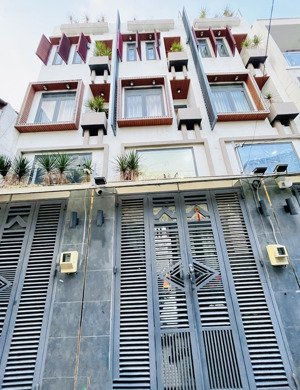 bán nhà 4 tầng 5pn-ngay phan huy ích-kế bên emart chỉ 6đ