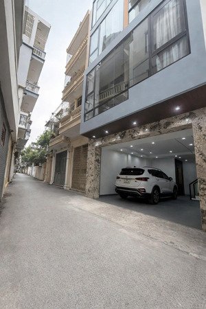 nhà mới thang máy, ô tô đỗ cửa, 30m ra mp, dt 58m2, mt 5,2m, 7t kd tốt, chào 23,5 tỷ qh ổn định