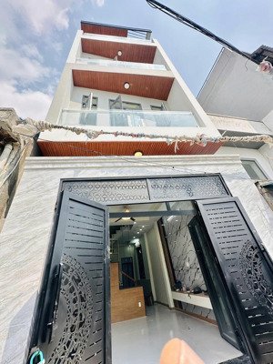 nhà 4 tầng mới 100%, hẻm xe hơi 5m, gần lê văn việt.