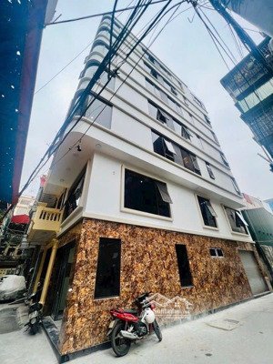 nguyễn trãi - tòa nhà văn phòng - lô góc 3 mặt ngõ - 7 tầng - thang máy - ô tô đỗ cửa