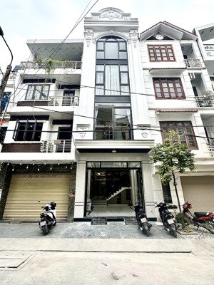 nhà 4 tầng thang máy phân lô phố văn cao