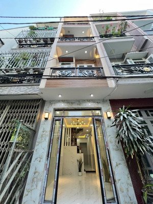 nhà mới 4 tầng hẻm ô tô đậu cửa khu cao tầng đồng bộ hẻm thông