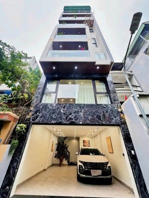 bán tài sản hiếm ở khu lõi nguyễn văn cừ: 7t + tum, mt 5m, gara 2 ô tô, thang máy, ngõ 5m thông