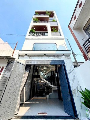 nhà phố xây mới 4 tầng 4,5m x15m.cách lê văn khương 100m.phường thới an.q12.lh 