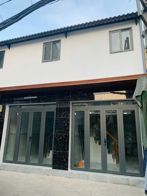 tôi bán nhà 38 m2 sd, 1 trệt, 1 lầu, xe hơi đậu trước nhà, tuyệt đẹp, quận 7, giá: 1,55 tỷ