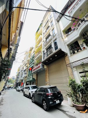 hơn 30 tỷ nhà khó tìm 77m2 9 tầng thang máy thông sàn, gara ô tô có hầm ngõ thông, thiện trí bán