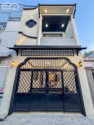 Nhà 1 trệt 2 lầu phong cách Indochine - Đậu ô tô trong nhà - Gần siêu thị Lotte