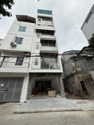 bán nhà như hình. 50m, 7 tầng, thang máy 630kg, đường ô tô vỉa hè, kinh doanh tốt