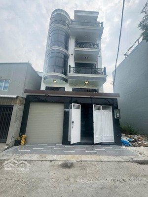 nhà bè - khu phân lô đồng bộ - oto ngủ nhà - ngay chợ bà chồi - 5 tầng - 7x14m -thang máy, hồ bơi