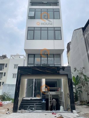 tòa nhà "mới" trương văn bang 5*20m, hầm trệt, lửng, 2 lầu suốt, thang máy, 60 triệu/tháng